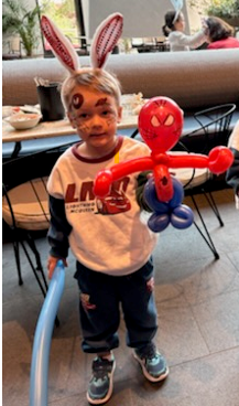 Child holding a balloon creation