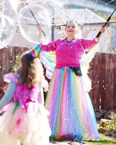 Children enjoying giant outdoor bubbles