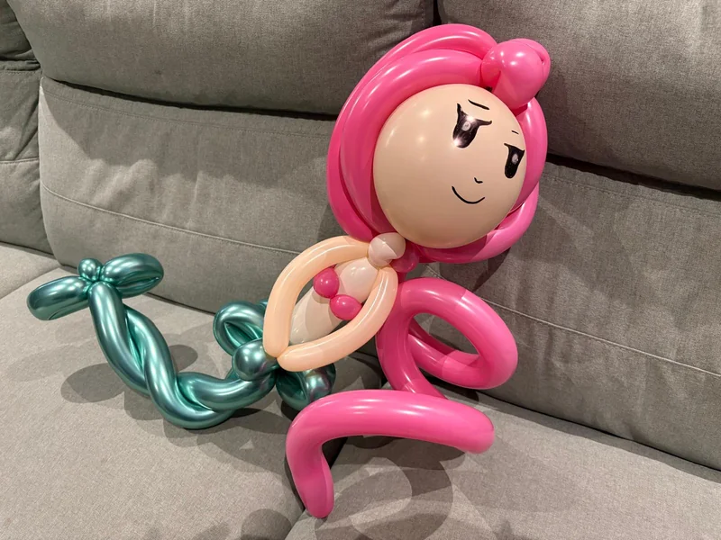 A balloon mermaid with pink hair