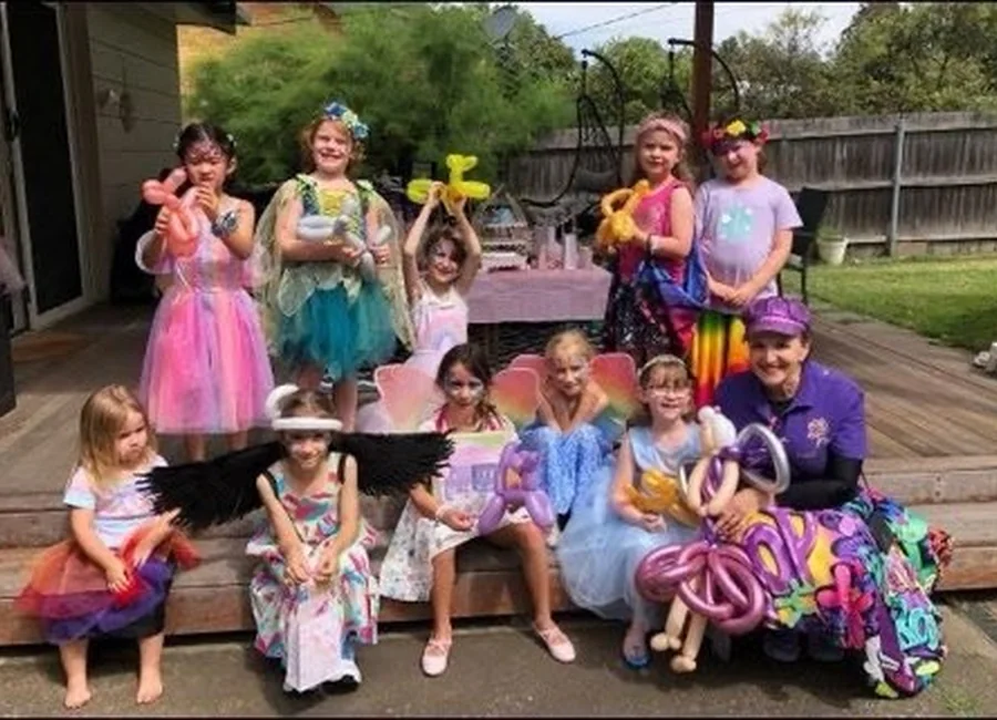A colourful children's party with games and balloons